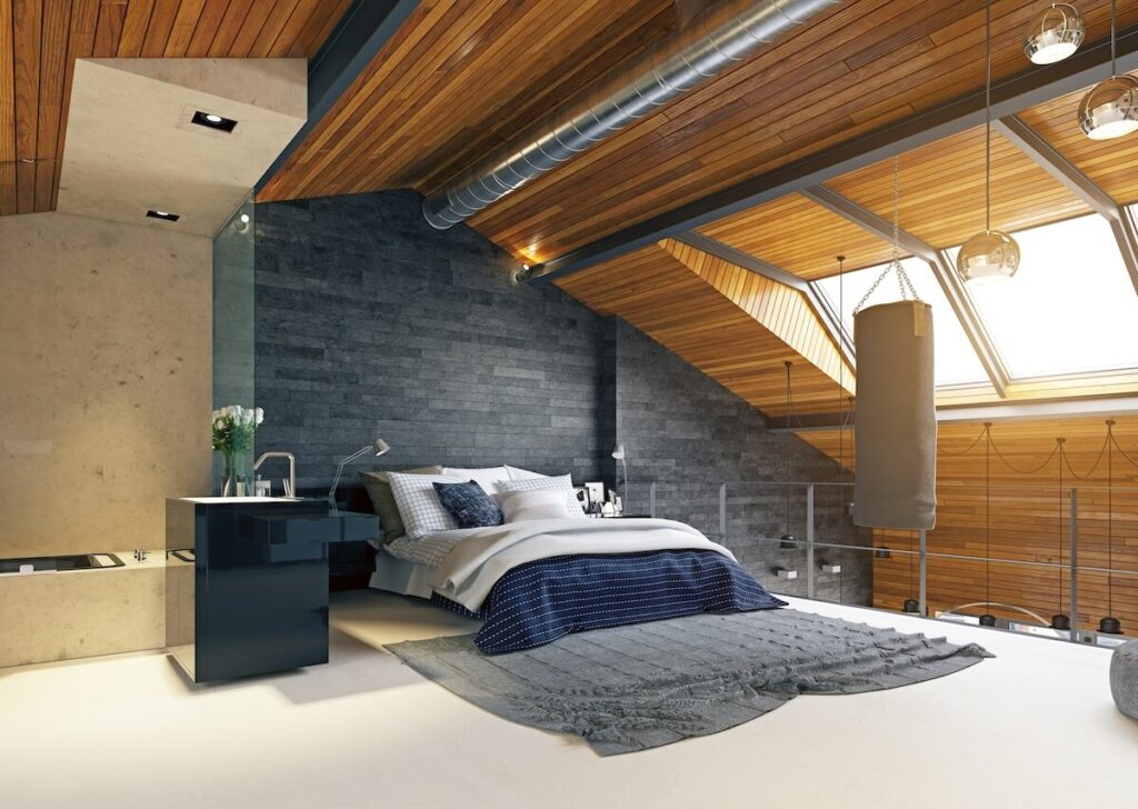 Une suite parentale lumineuse aménagée sous les combles avec une fenêtre de toit de type Velux.